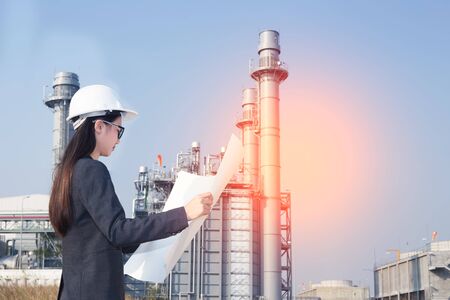 woman engineer and men engineer working new project in power plantの写真素材
