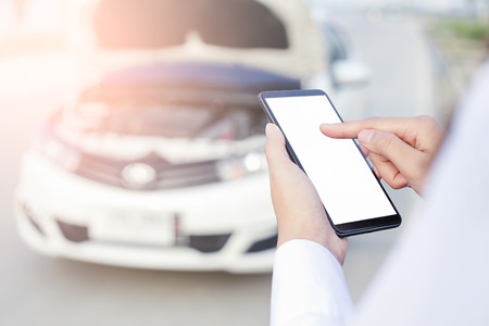 Beautiful Business woman sitting on car seat and fastening seat belt, car safety concept.の写真素材