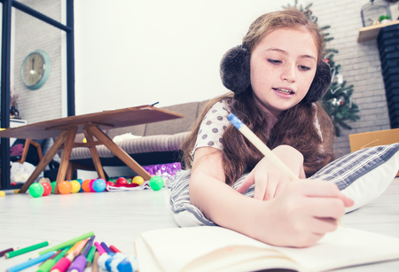 Two girls drawing a picture and Little Girl Holding Magnifying Glass Smiling.have copy space in enter text.の写真素材