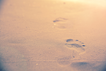 Beach sand footprint ocean coast sea azurewave with bubble. . Tropical travel, summer vacation holiday paradise resort background template.の写真素材