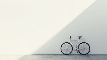 A bicycle resting against a wall, with ample space for textの素材