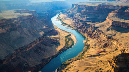 Aerial view of the Colorado River winding through the Grand Canyon, with space for text aboveの素材