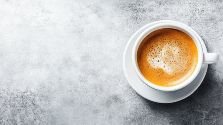 Top view of a steaming cup of coffee on a white table, with ample copy space for textの素材