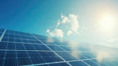 Solar panels arranged neatly with clear sky, perfect for adding copyの素材