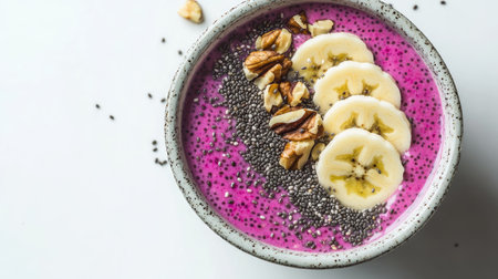 This vibrant smoothie bowl features banana slices and chia seeds, perfect for a healthy breakfast. A colorful treat packed with nutrients and flavor.の素材