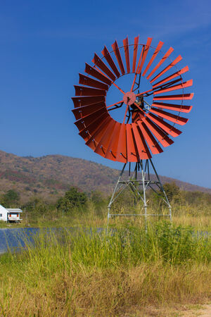 Red turbines for pump water and lagoonの写真素材