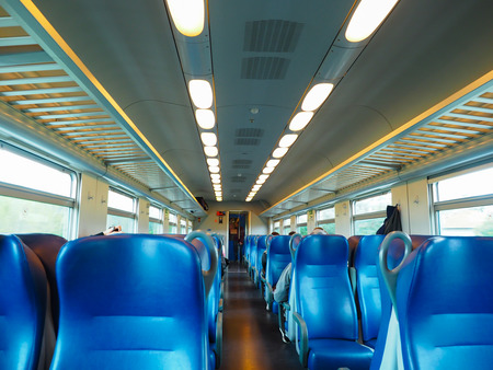 Blue chair in the train carriagesの写真素材