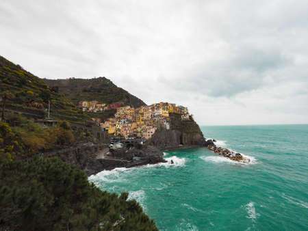 Manarola beautiful seaside town of Italy on a stormy day.の写真素材