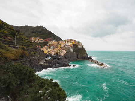 Manarola beautiful seaside town of Italy on a stormy day.の写真素材