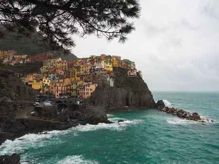 Manarola beautiful seaside town of Italy on a stormy day.の写真素材