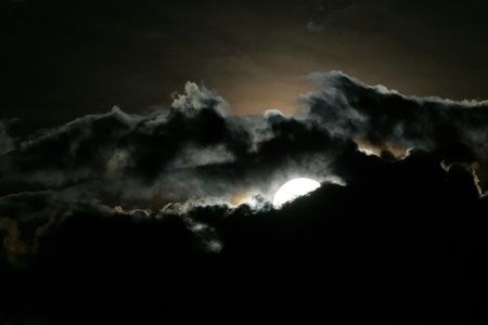 Full moon and clouds on night sky                               