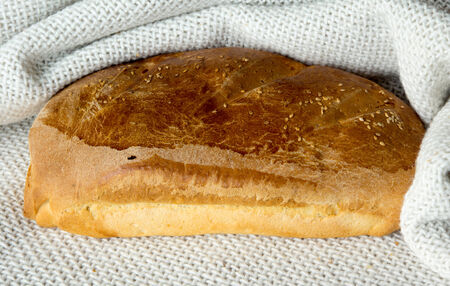 Fresh loaf bread in a towel.