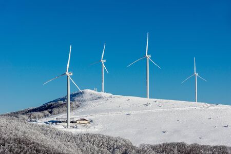 Frozen wind turbines in mountain high