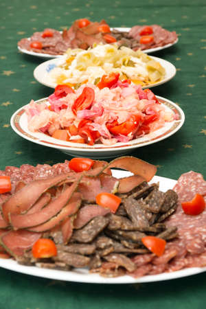 Plates with different appetizersの写真素材