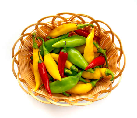 Chilies in basket on white backgroundの写真素材