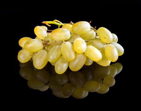 Grape on reflective black studio backgroundの写真素材