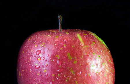 Red apple on black background