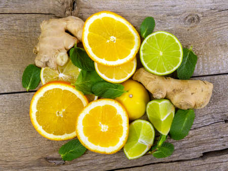 Close up of group of citric fruits over wooden boardの写真素材