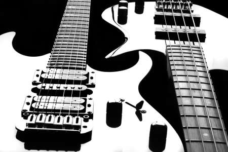 Electric guitar and bass guitar on black background