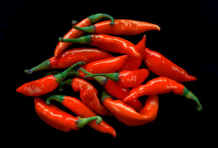 Red hot peppers isolated on black backgroundの写真素材