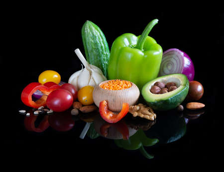 Different vegetables on reflective black backgroundの写真素材