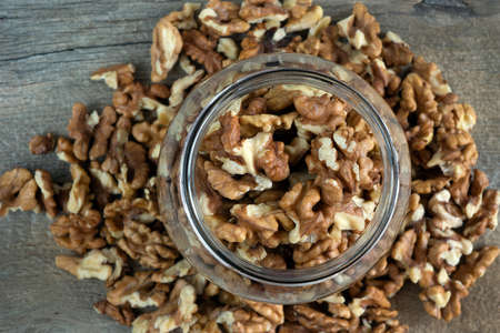 Walnuts in a glass jarの写真素材