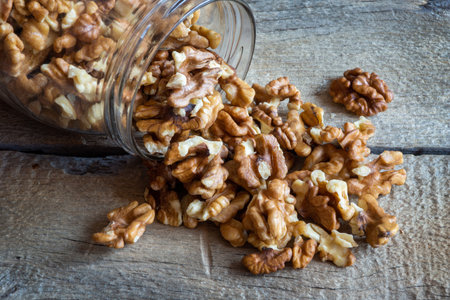 Walnuts in a glass jarの写真素材