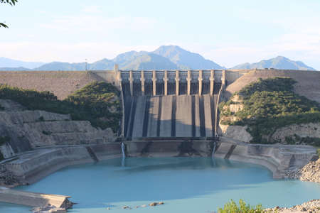 Tarbela Dam is an earth-filled dam along the Indus River in Pakistanâs Khyber Pakhtunkhwa province. Located in the Swabi and Haripur Districts of the province, the dam is about 30 km from the city of Swabi, 105 km northwest of Islamabad, and 125 km eastのeditorial素材