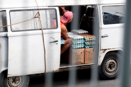salvador, bahia / brazil - july 12, 2018: egg seller is seen in a kombi vehicle in the city of Salvador. *** Local Caption ***のeditorial素材