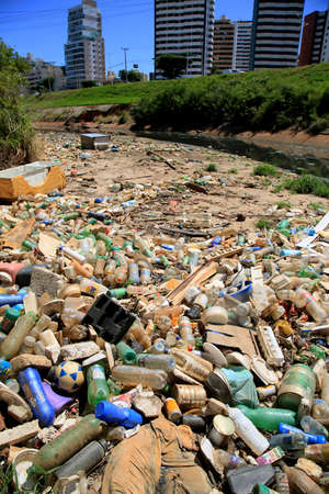 salvador, bahia, brazil - january 6, 2021: garbage and pet bottles are seen accumulated in a canal...