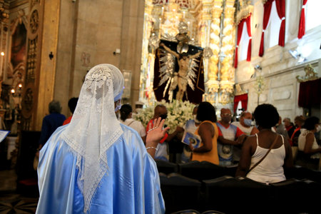 salvador, bahia, brazil - january 1, 2021: Catholics wear mascots and buy social distance during mass at the Church of Nossa Senhora da Conceicao da Praia in the outgoing city of Salvador.のeditorial素材
