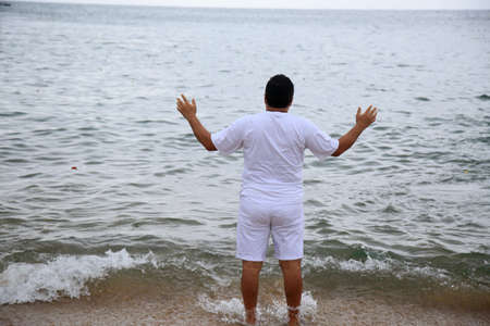 salvador, bahia, brazil - february 2, 2021: members of the Candomble religion are seen during an offering delivery to the orisha Yemanja on the Rio Vermelho beach in the city of Salvador.のeditorial素材