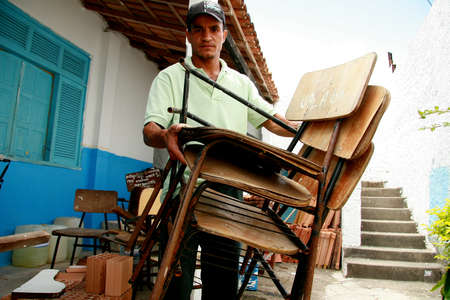 eunapolis, bahia / brazil - march 10, 2009: Broken classroom furniture is seen at the Municipal School in Eunapolis City.のeditorial素材