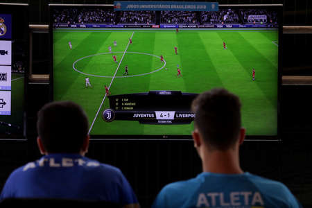 salvador, bahia / brazil - october 25, 2019: young people are seen playing video game football...