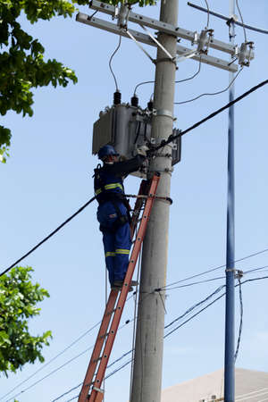 salvador, bahia / brazil - february 28, 2019: Electrician makes repairs to the power grid during the...