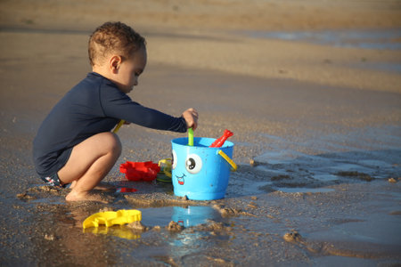 salvador, bahia / brazil - november 30, 2017: Child is seen playing on Pituacu beach in the city of Salvador.のeditorial素材