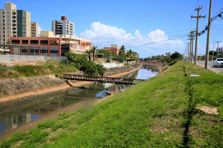 salvador, bahia, brazil - january 6, 2021: view of the Rio Camurugipe canal in the city of Salvador. The river receives sewage water and is thrown at Pituba Beach.のeditorial素材