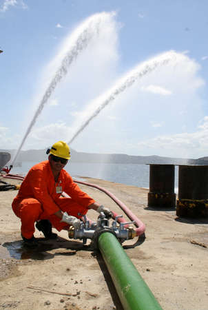 madre de deus, bahia, brazil - august 16, 2006: fire-fighting brigades are seen during training with...