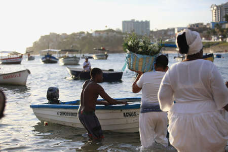 salvador, bahia / brazil - february 1, 2018: Movement of Orixa Iemanja devotees and supporters in the Rio Vermelho neighborhood of Salvador, during preparations for the feast that will take place on February 2. *** Local Caption ***.のeditorial素材