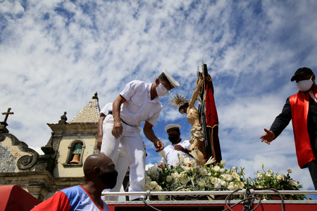 salvador, bahia, brazil - january 1, 2021: Image of Bom Jesus dos Navegantes arrives at the church of Boa Viagem after being driven in a fire brigade vehicle on the streets of the city of Salvador.のeditorial素材
