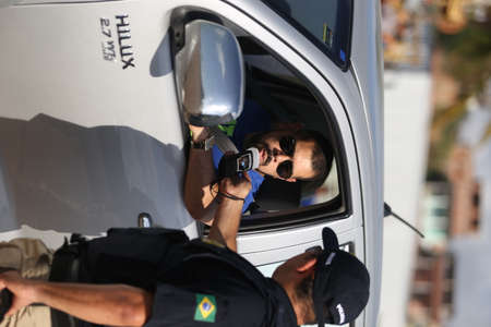salvador, bahia / brazil - october 11, 2018: Federal Highway Police (PRF) officer approaches the...