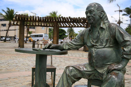 salvador, bahia, brazil - december 21, 2020: Statue of the poet Vinicius de Moraes is seen in the neighborhood of Itapua, in the city of Salvador.のeditorial素材