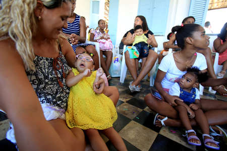 salvador, bahia / brazil - april 27 2017: Child with microcephaly are seen at the Embrace Microcephaly Association. A group of mothers and volunteers to support families and their babies with congenital Zika syndrome and microcephaly. *** Local Caption **のeditorial素材