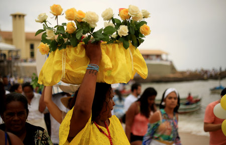 salvador, bahia / brazil - february 2, 2015: supporters of candomble are seen on the Rio Vermelho beach in the city of Salvador during a party in honor of Yemanja.のeditorial素材