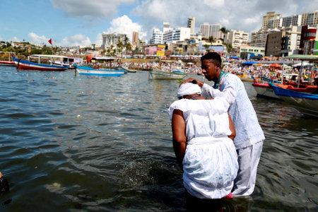 salvador, bahia / brazil - february 2, 2015: supporters of candomble are seen on the Rio Vermelho beach in the city of Salvador during a party in honor of Yemanja.のeditorial素材