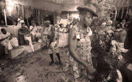 simoes filho, bahia / brazil - february 27, 2016: Candoble supporters are seen during celebration in religious temple in the city of Simes Filho.のeditorial素材