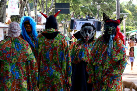 itacare, bahia, brazil - february 20, 2012: people are seen wearing masks during the carnival in the city of Itacare.のeditorial素材