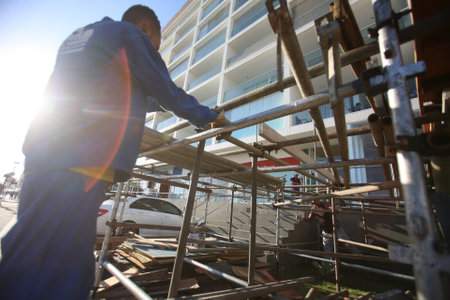 salvador, bahia / brazil - january 29, 2018: Worker is seen assembling structure for carnival party in Barra neighborhood in Salvador.のeditorial素材