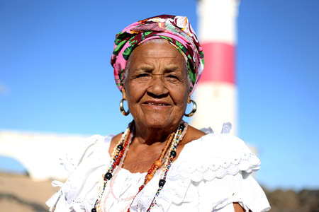 salvador, bahia / brazil - march 2, 2017: members of the cultural group As Ganhadeiras de Itapua seen at the Itapua Lighthouse in Salvador city.のeditorial素材