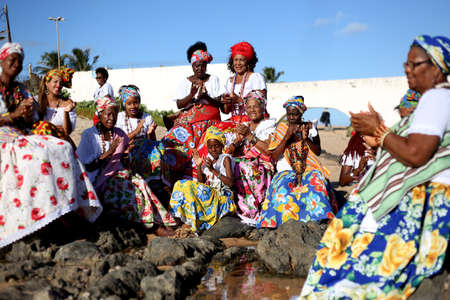 salvador, bahia / brazil - march 2, 2017: members of the cultural group As Ganhadeiras de Itapua seen at the Itapua Lighthouse in Salvador city.のeditorial素材